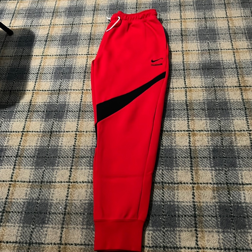 Mens Nike trademark pants. Black and red